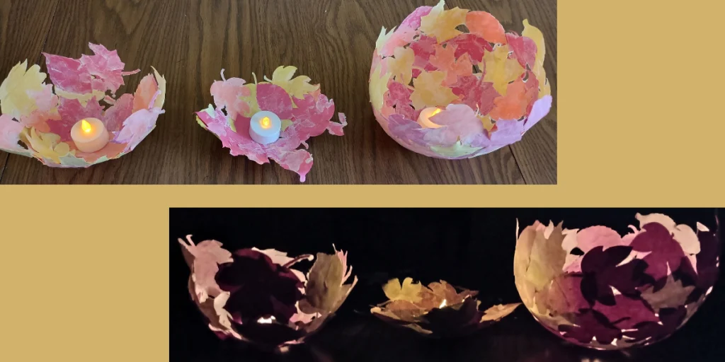 Picture of three paper mache leaf bowls with led tea lights inside them. This fall craft is shown in both the light and the dark