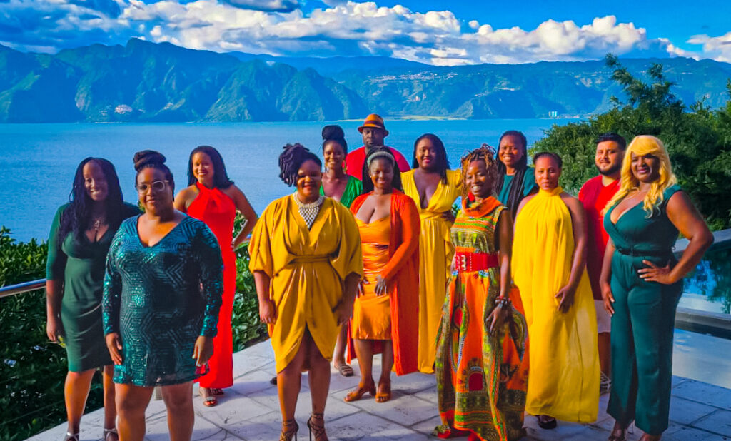 The Traveling Black Women Network wearing jewel colors in Lake Atitlan, Guatemala during Libra Season