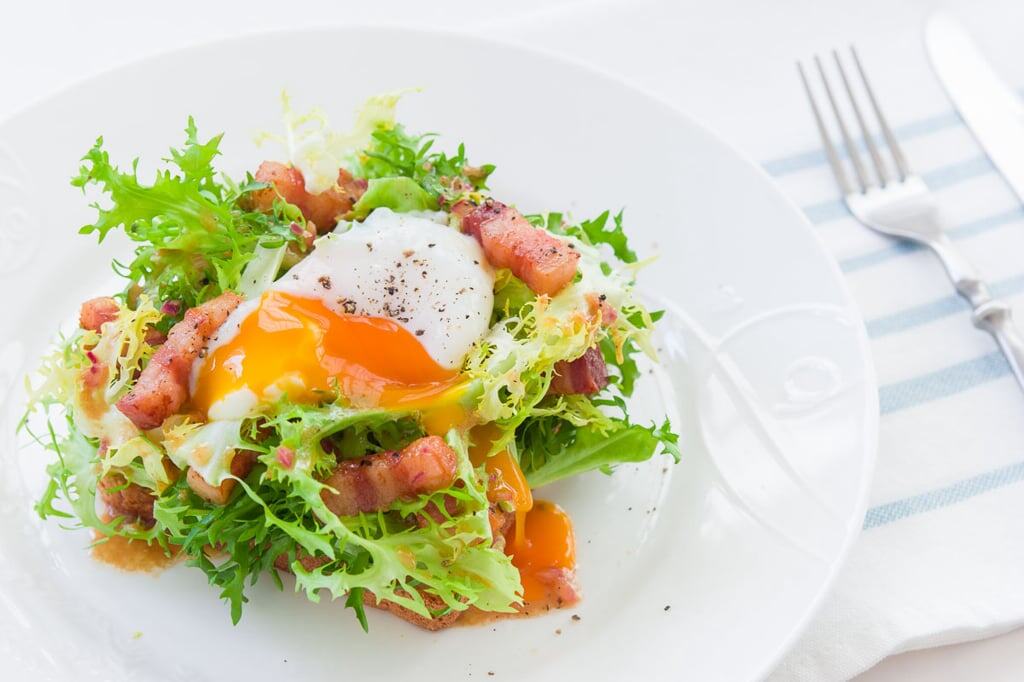Salade Lyonnaise Recipe A slow cooked egg on top of a classic French Salade Lyonnaise.