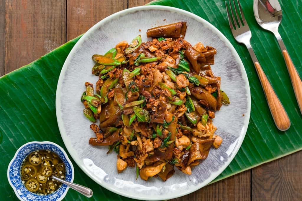 Pad See Ew Recipe Thai Pad See Ew stir-fried noodles with chicken, egg, and greens seasoned with dark soy sauce.