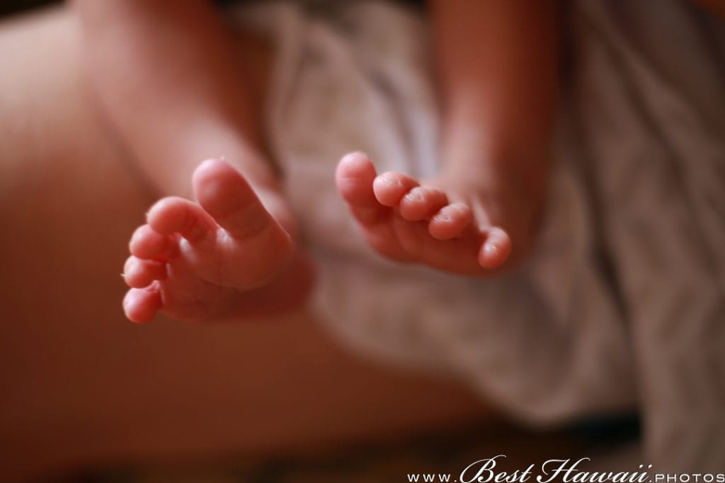 Tiny toes of our newborn daughter