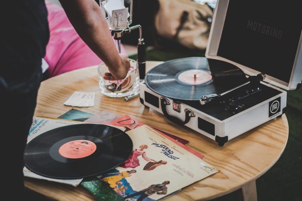 record player on table cleaning vinyl records with alcohol