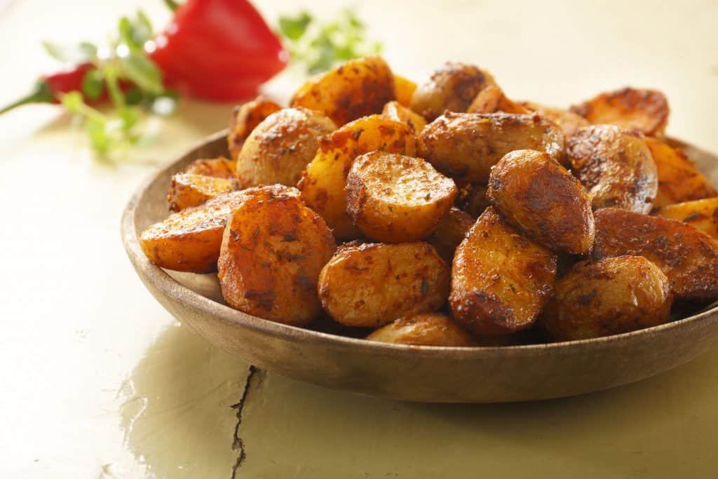 Peka potatoes mexican style are potato halves cooked and seasoned with spices.