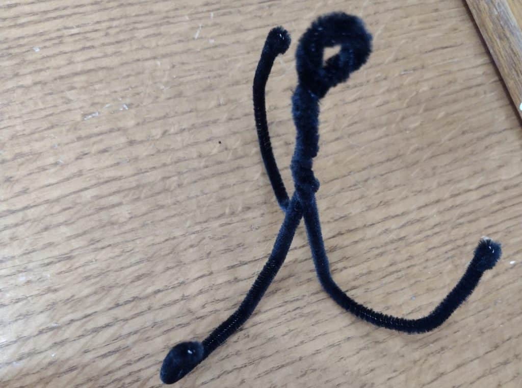 Side view of a pipe cleaner pipe grappling hook