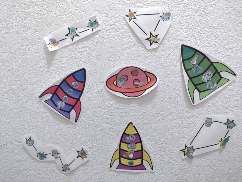 Picture of space themed sticker charts completed with stickers