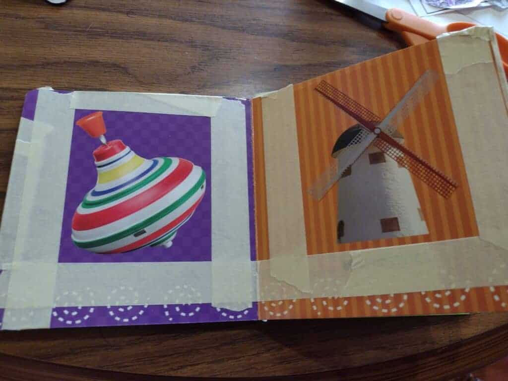 Picture of a board book with masking tape in rectangles around the pcitures