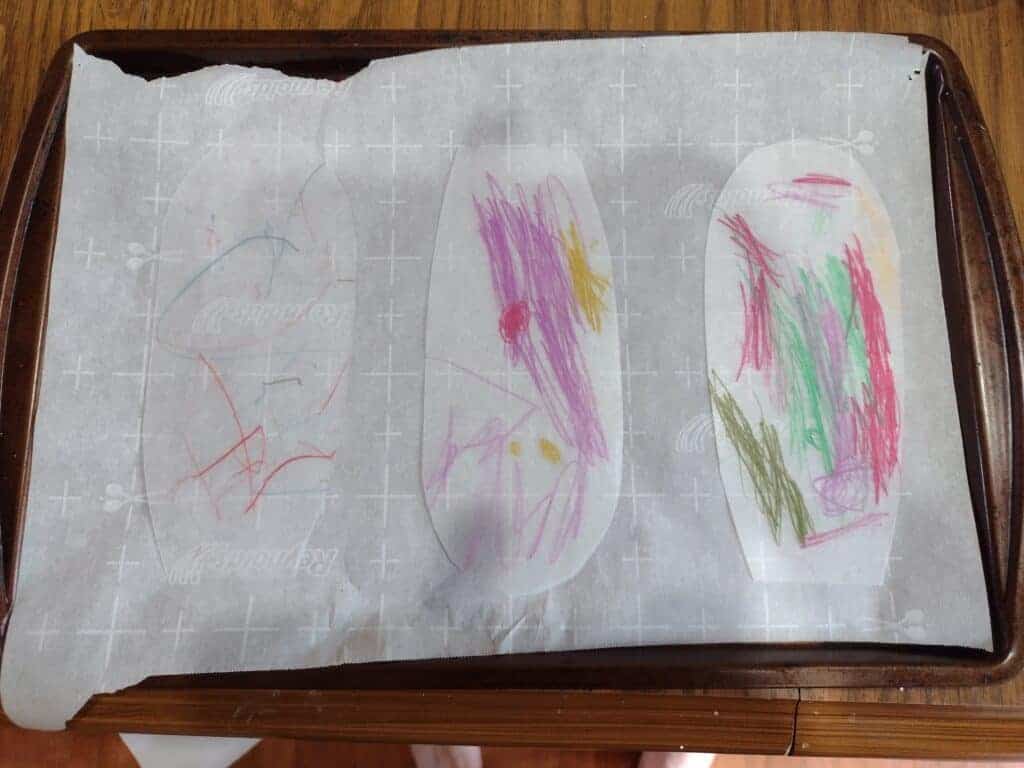 Picture of three flower petal shaped Shrinky Dinks for a pinwheel before shrinking