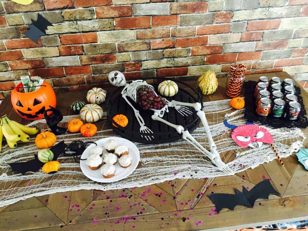 Skeleton with grapes in his stomach laid out on a table