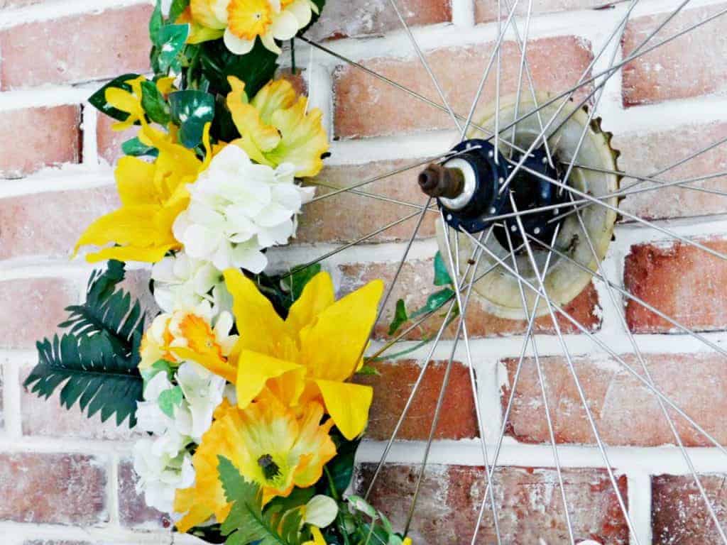Bicycle Wheel Wreath yellow flowers close up of spokes