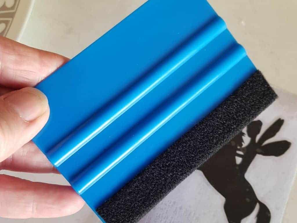 Squeegee tool to press vinyl firmly