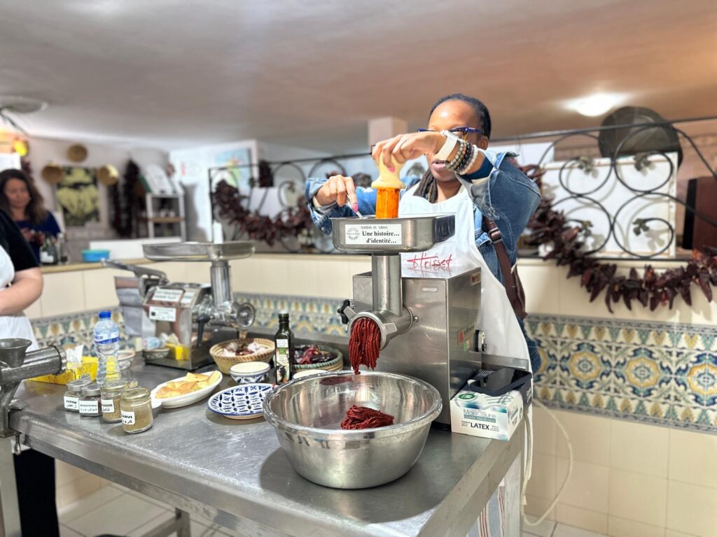 Black Woman in Tunisia Making Harissa