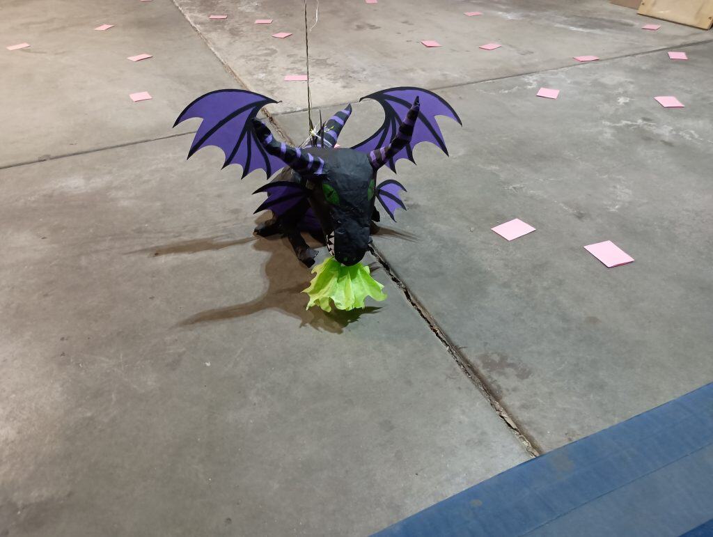 Picture of a DIY Maleficent pinata sitting on the floor of a garage