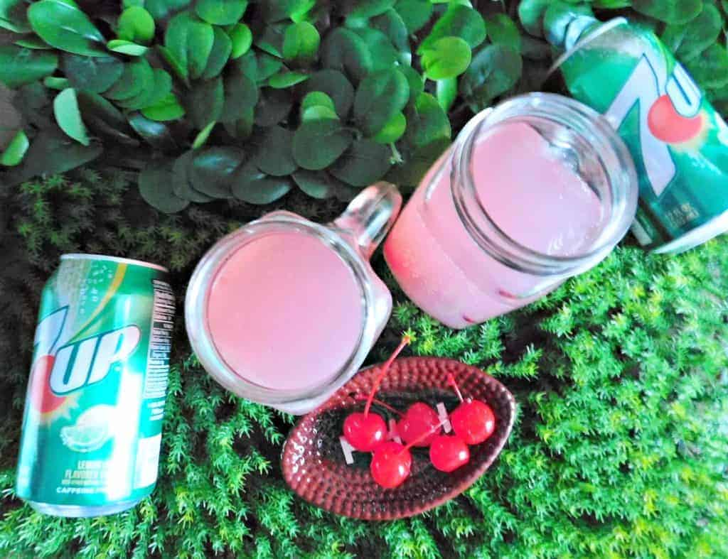 football party punch with 7UP on grass background with cherries