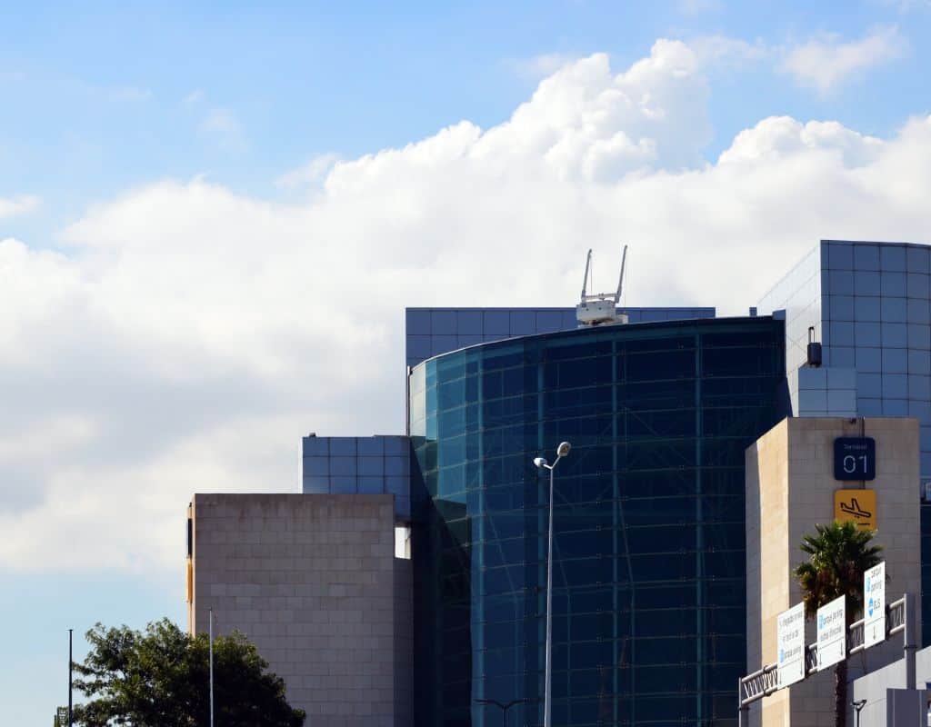 LIsbon International Airport Terminal 1 as seen from outside on a. cloudy day.