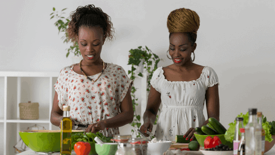 two women preparing food