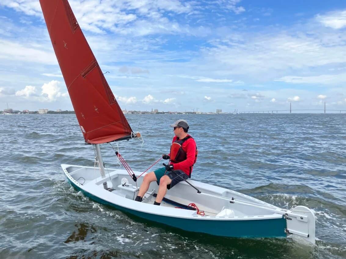 Viola Sailing canoe very pretty photo red sail elegance