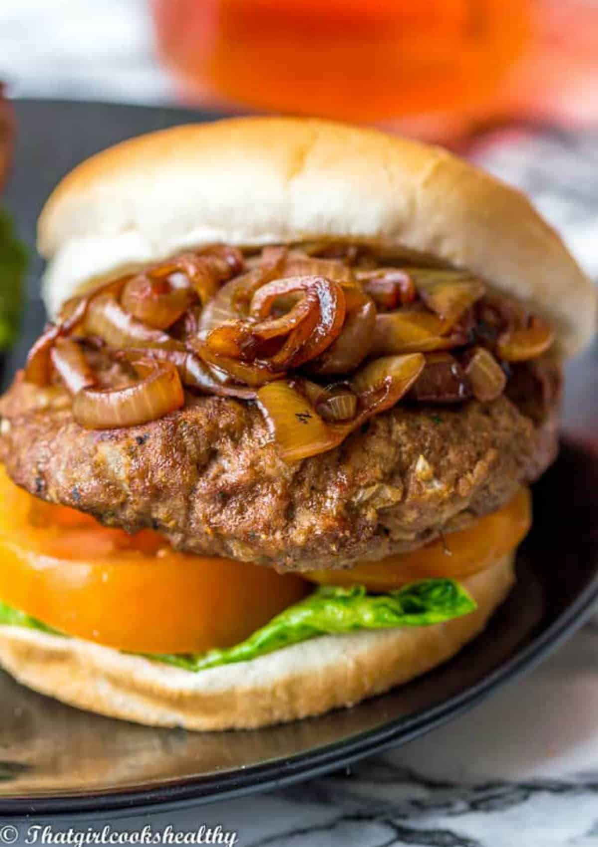 burger with caramelized onions exposed