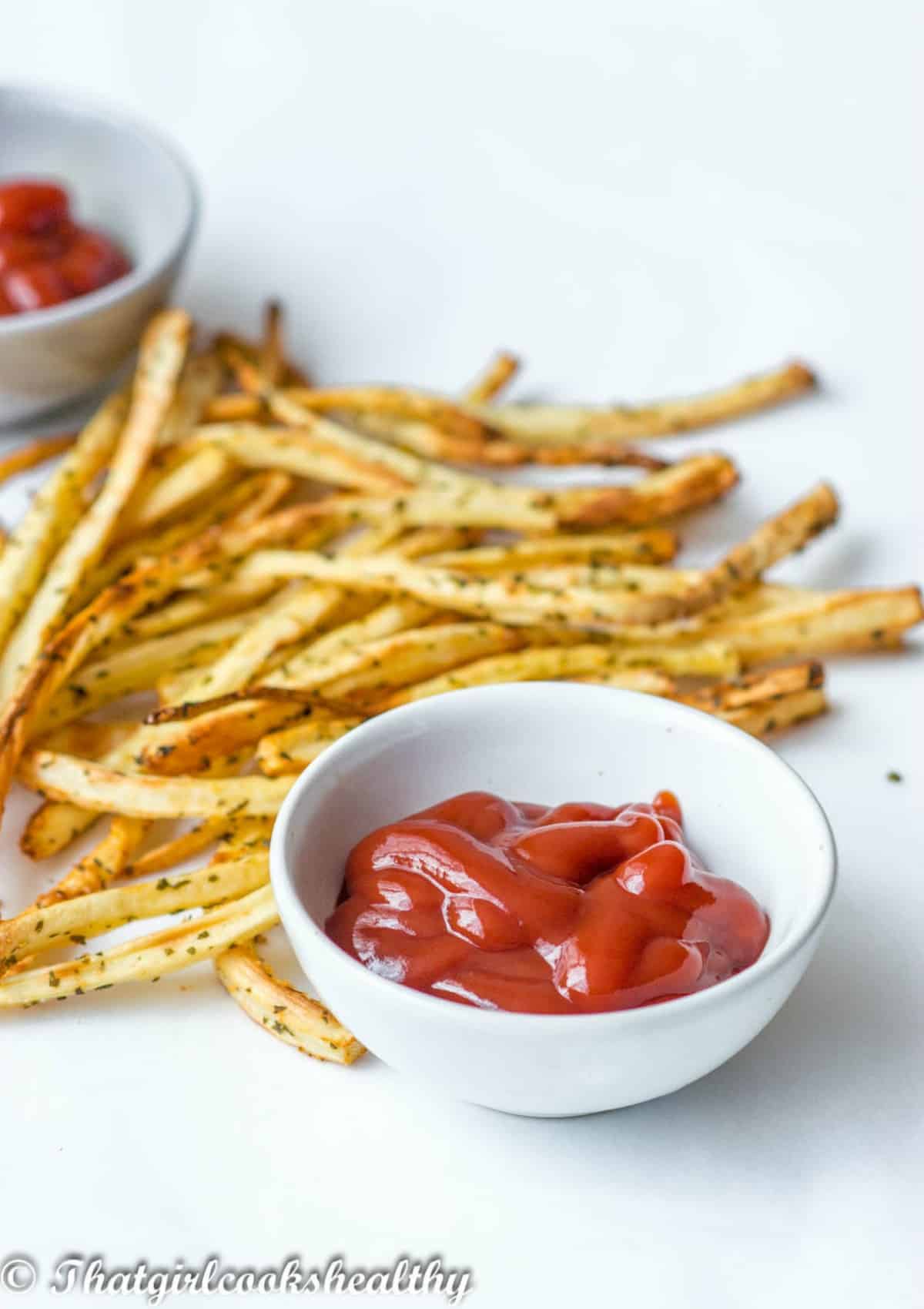 fries on white background with red dip