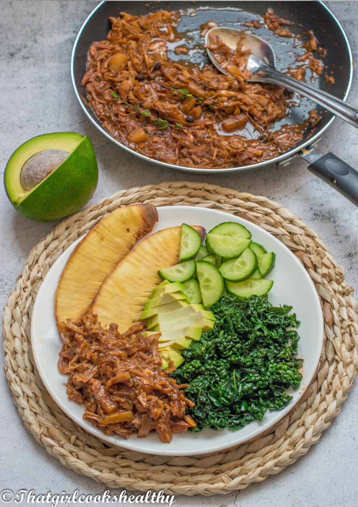 Jackfruit, breadfruit, kale and cucumbers on a plate