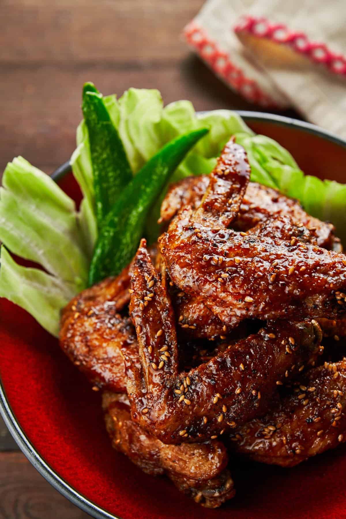 Secrets to making the crispiest wings ever! Glazed in a sweet and savory sauce that's loaded with ginger, garlic and black pepper this Tebasaki recipe is dangerously addictive.