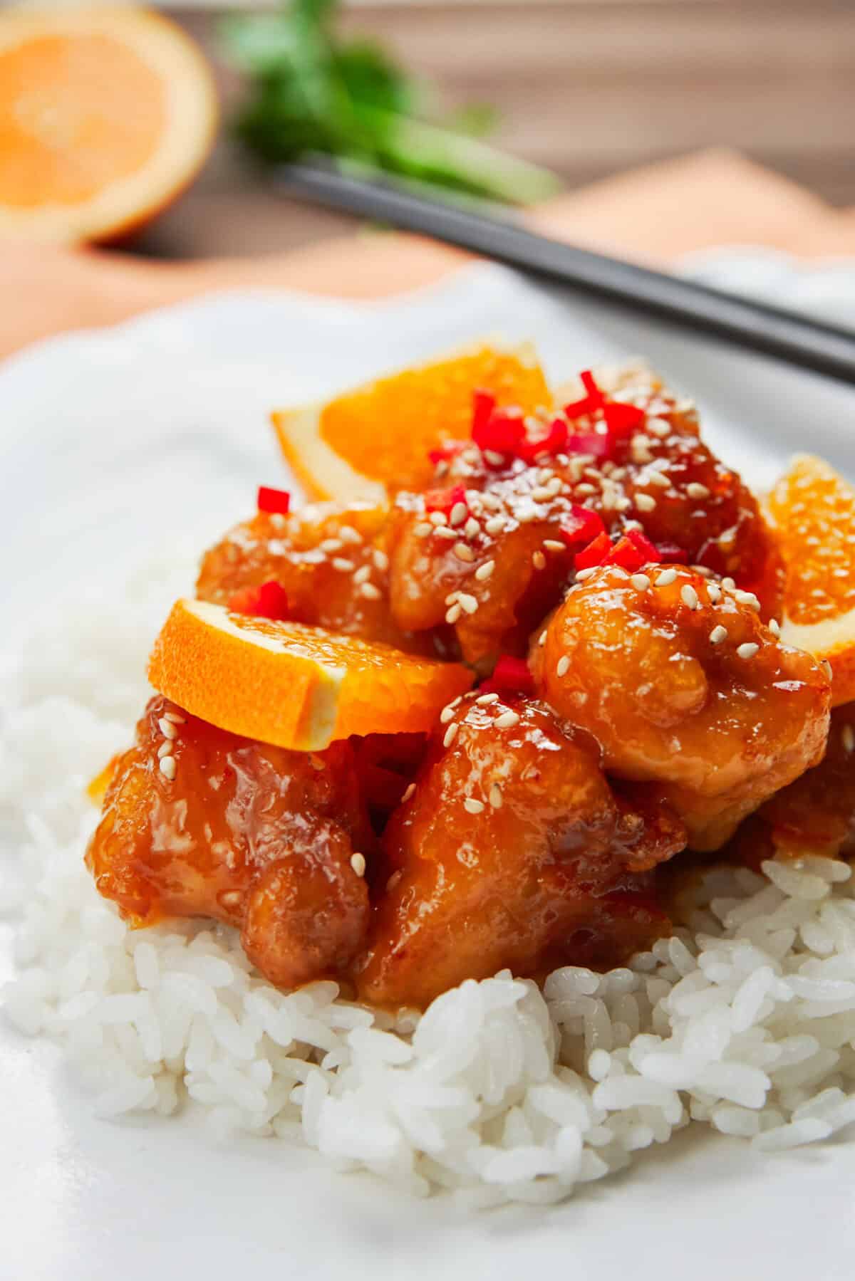 Crisp juicy fried chicken glazed in a sweet and sour orange sauce that's redolent of fresh citrus thanks to a triple dose of orange.