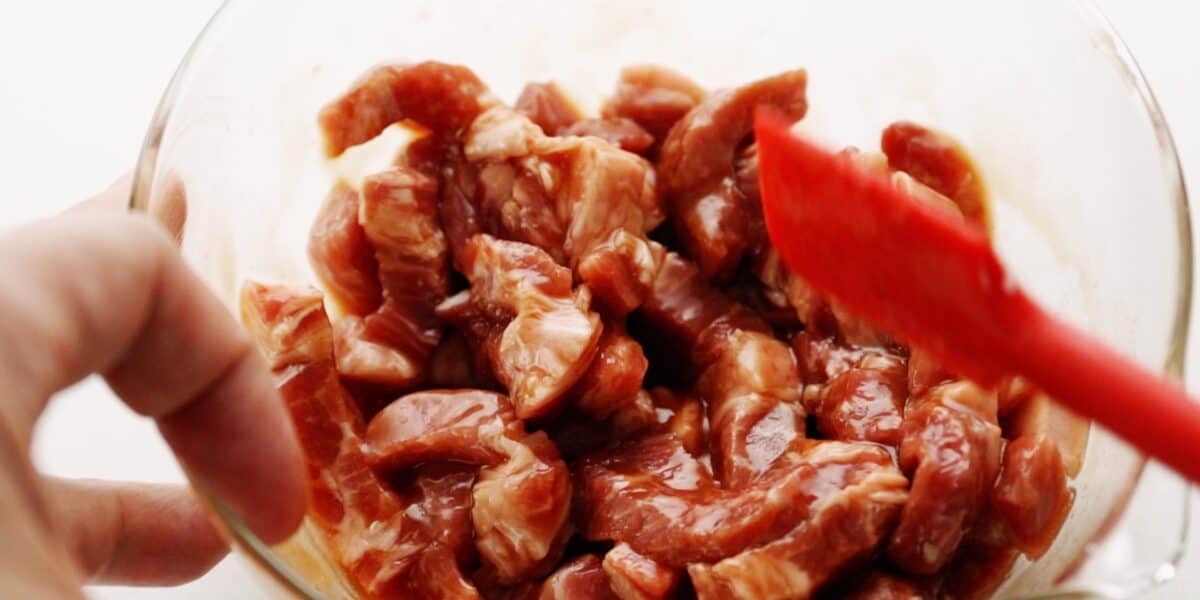 Marinating pork for making Chop Suey.