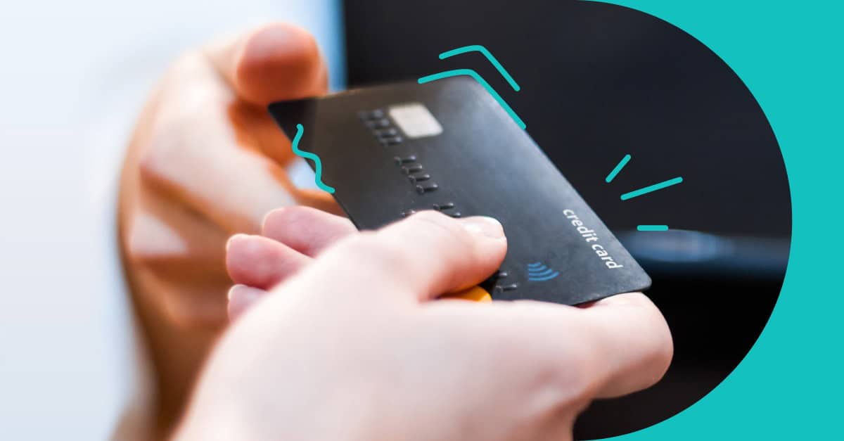 Credit Card linkage featured image for Thanx showing 2 people passing a credit card