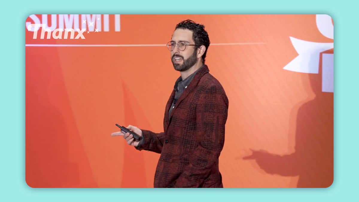 Cropped photo of Zach Goldstein speaking at Fast Casual Executive Summit in October of 2021