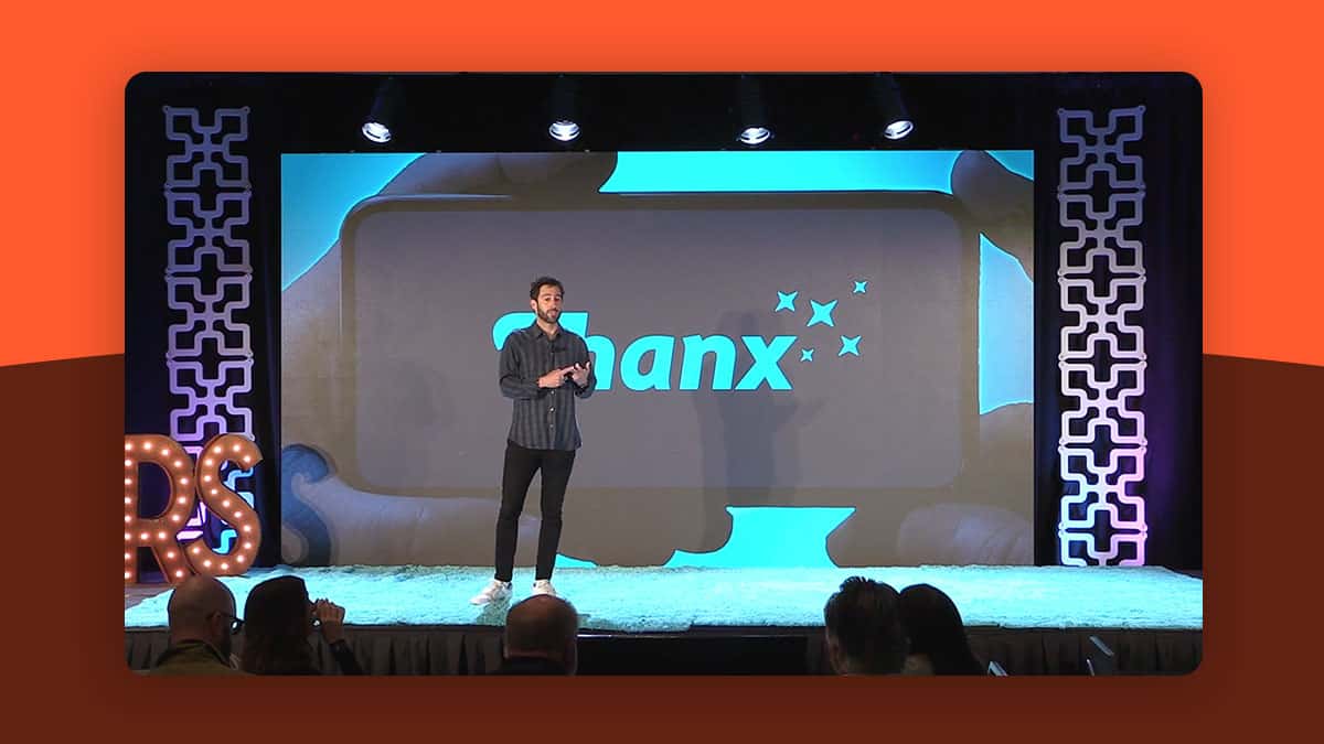 Screenshot of a video of Zach Goldstein, from Thanx, presenting on stage at Restaurant Spaces 2022