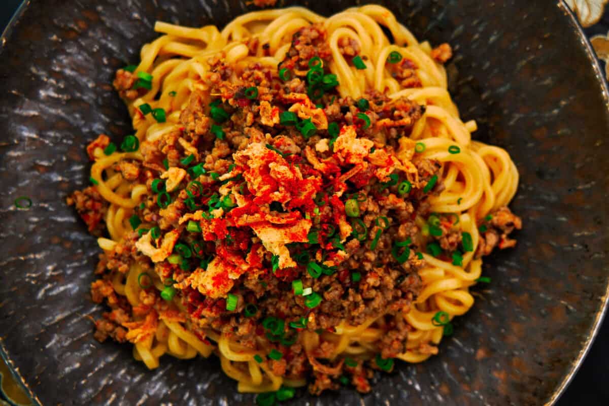 Tantanmen is the Japanese version of Dandanmian. With ramen noodles tossed in a spicy, nutty sesame sauce topped with an umami-packed ground pork stir-fry.