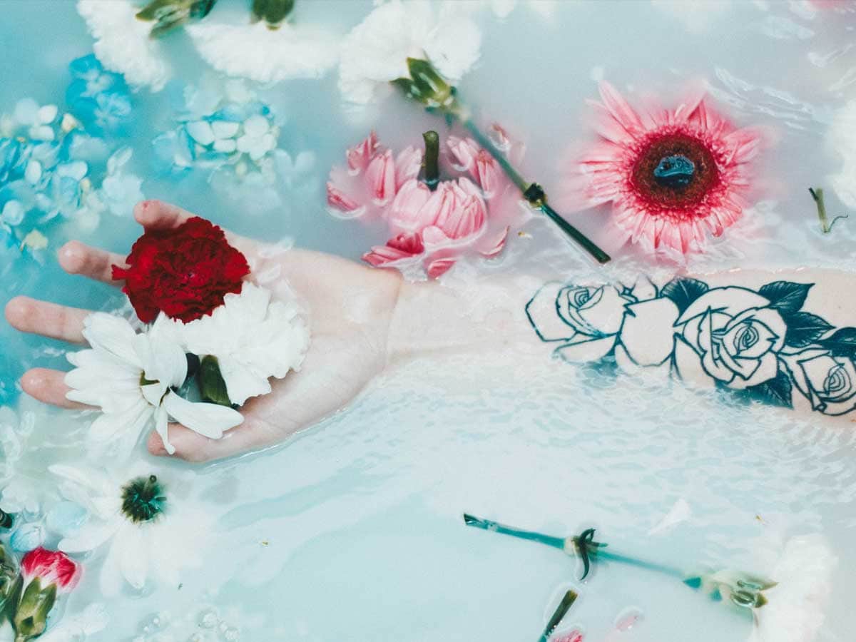 flowers on person's hand while milk bath I You Create Iloilo I Glory Moralidad I Iloilo Blogger