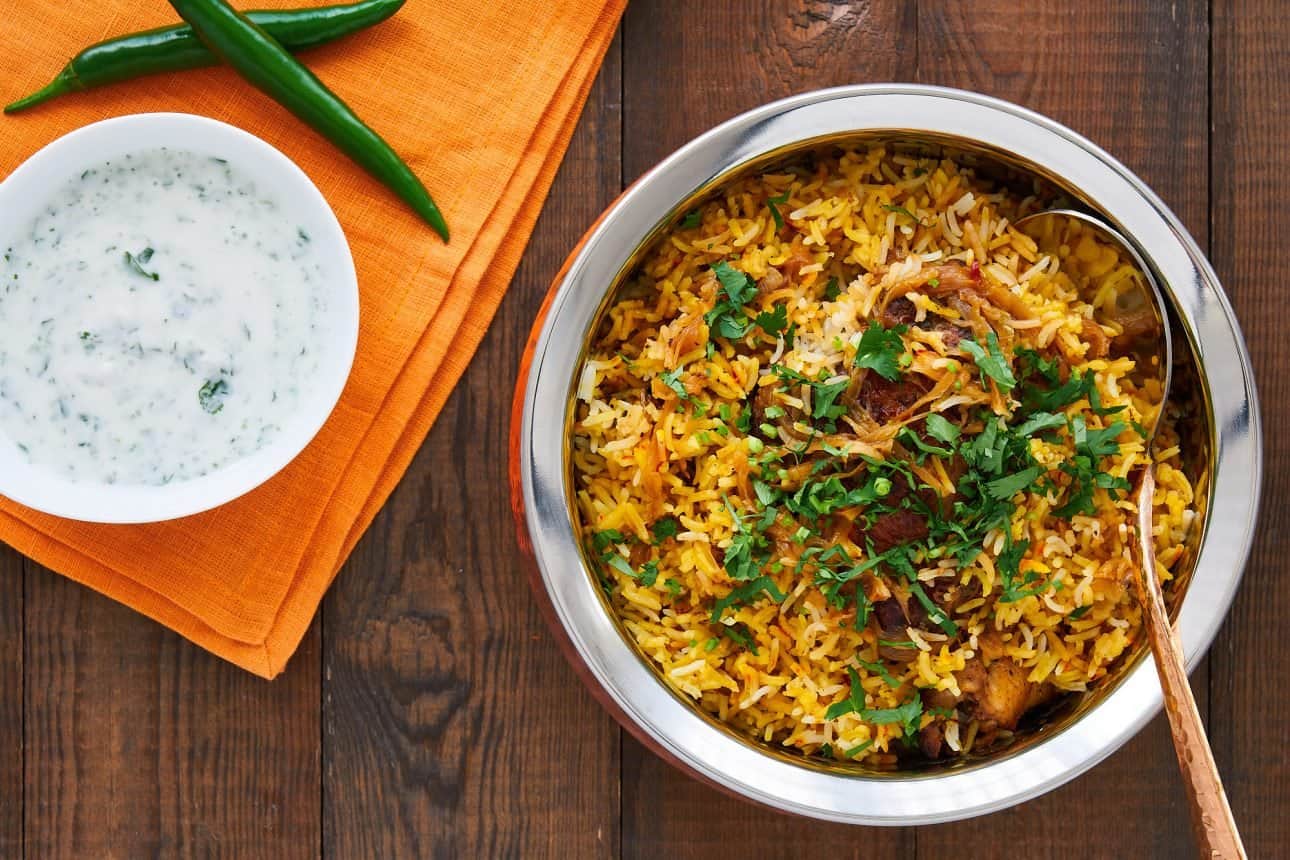 This Chicken Biryani isn't hard to make and yet it's decadently flavorful with spiced chicken and caramelized onions cooked in saffron rice.