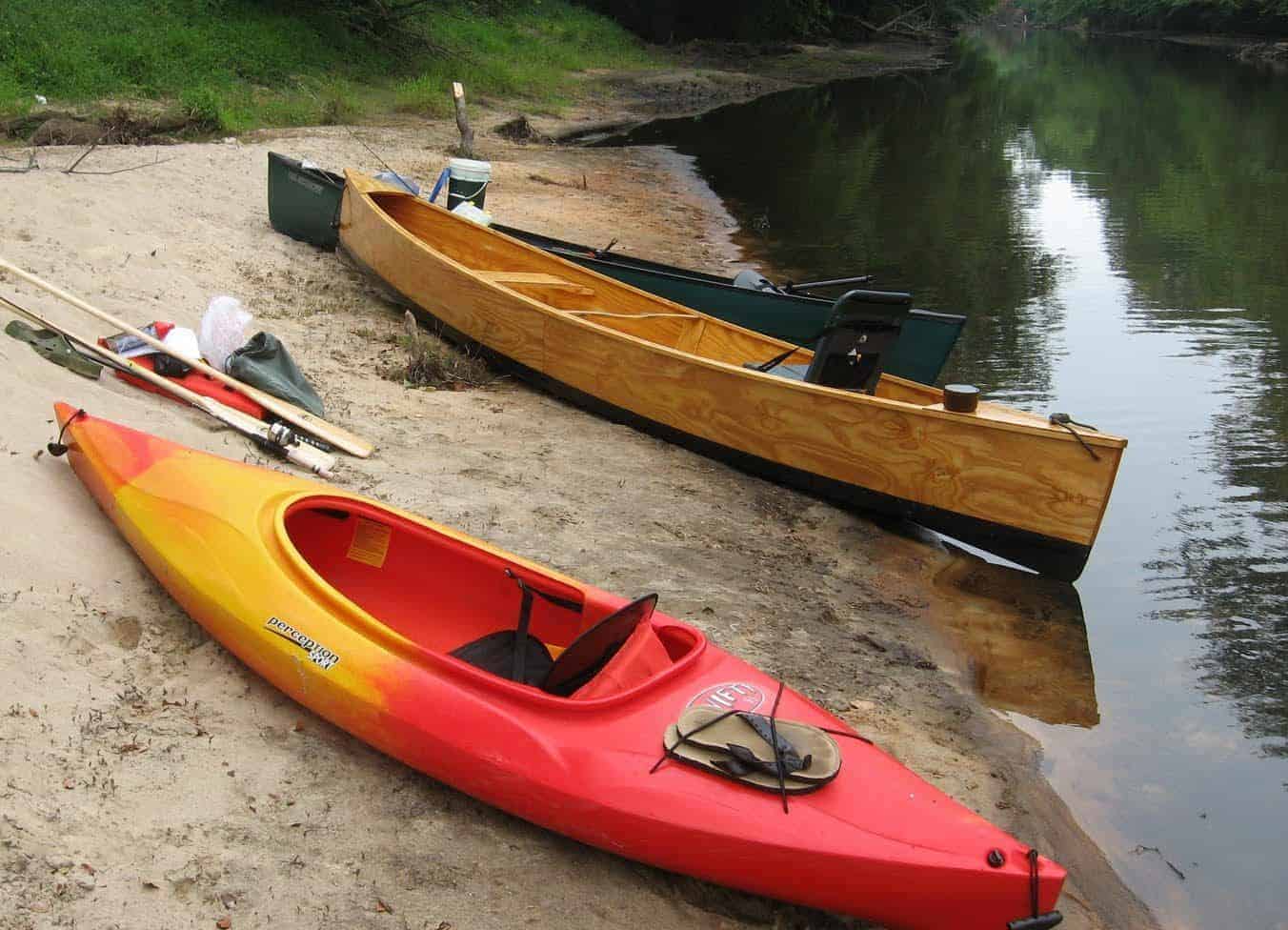 Plywood DIY canoe looks good on the beach.