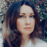 A woman with long dark hair.