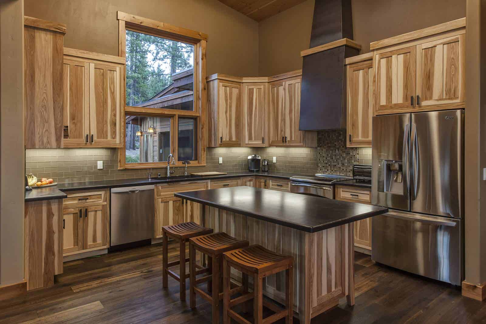 cozy contemporary kitchen with non-stained hickory cabinets and multicolor dark wood floor