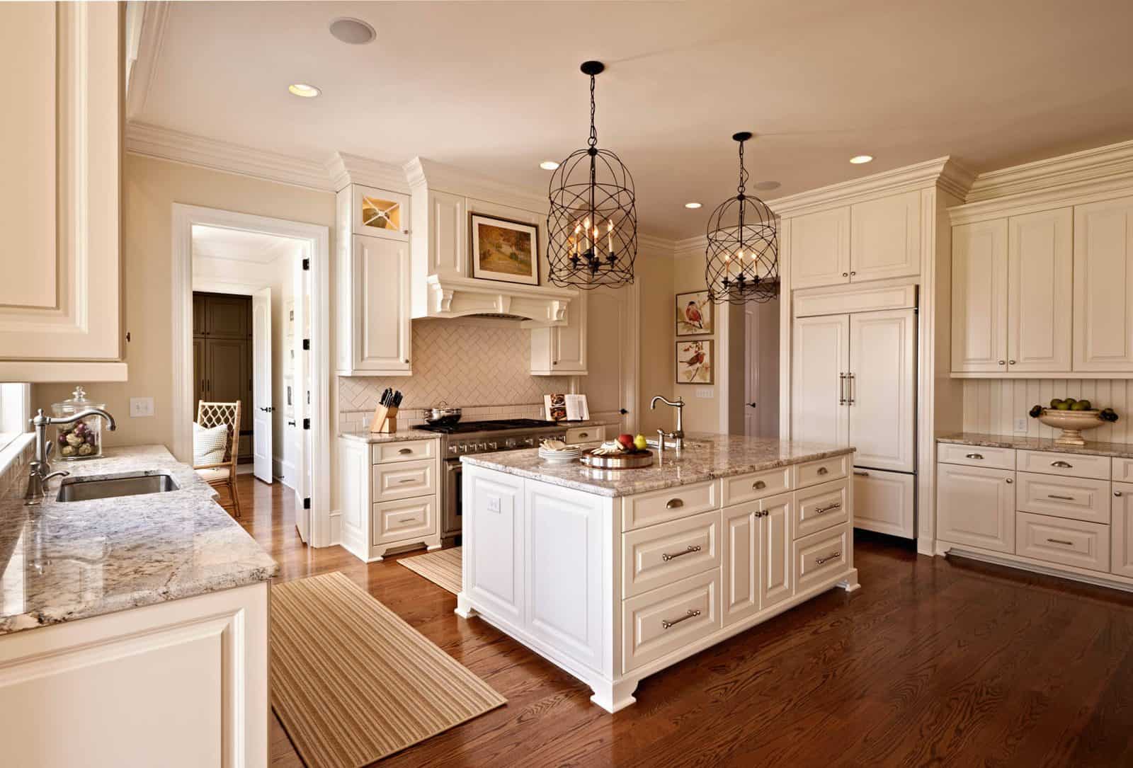 traditional kitchen with antique white cabinets and medium tone hardwood flooring