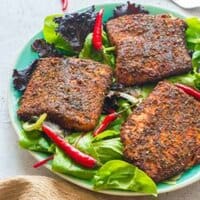 Fillets on a bed of leafy vegetables