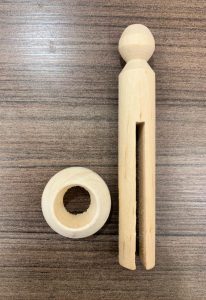 wooden clothes pin and base