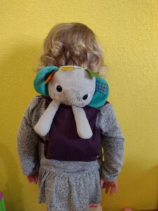 Picture of a toddler with a lovey backpack
