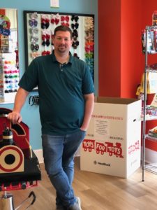 Pigtails & Crewcuts franchise owner Andrew McGehee standing in his kid's hair salon