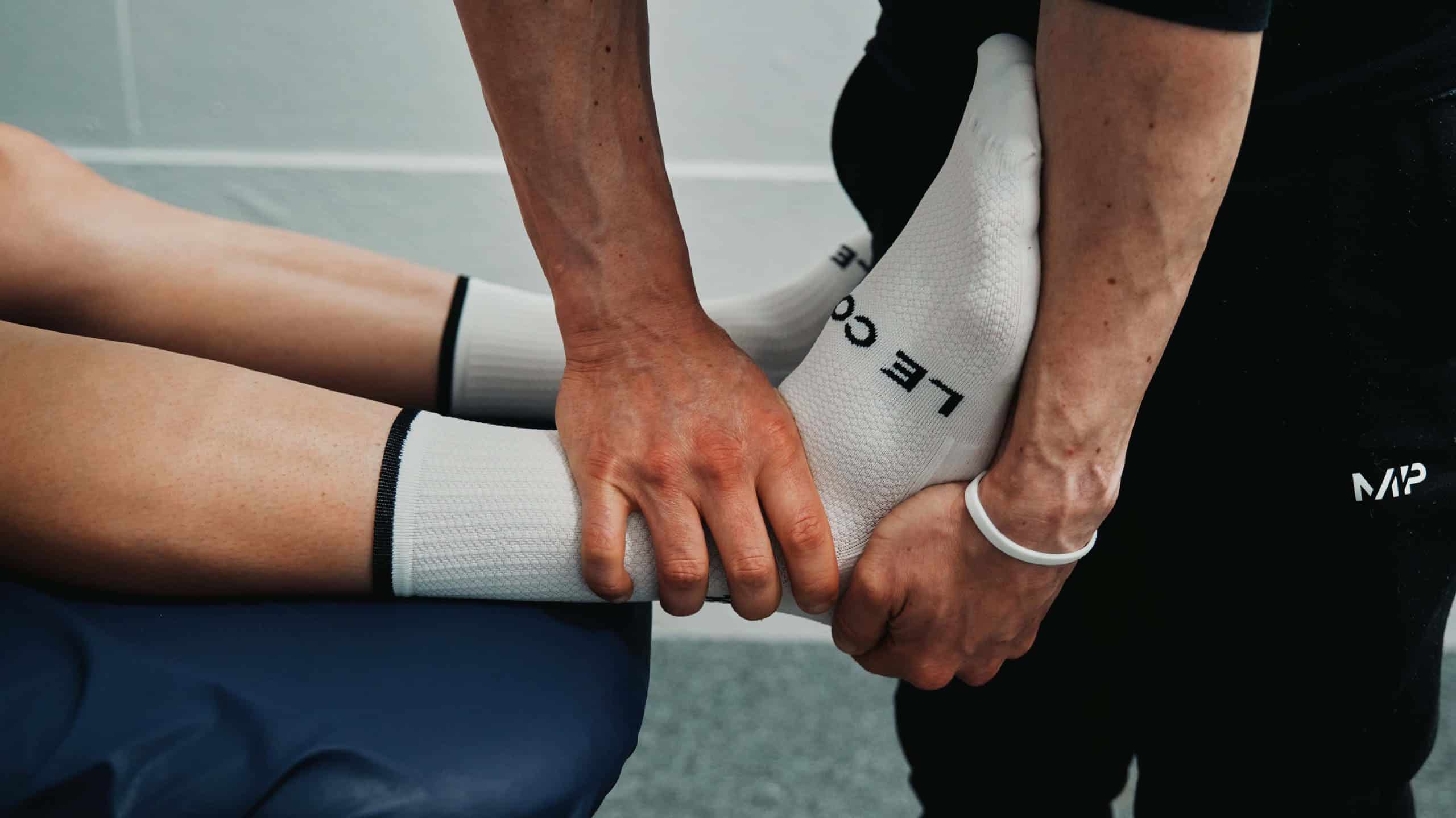 A sports therapist is assessing a lateral ankle sprain at seventy9 Sports Therapy, a sports injury clinic in Guildford, a sports therapy clinic in Guildford, sports therapy in Guildford, sports massage in Guildford, sports therapy clinic in Guildford, sports massage clinic in Guildford