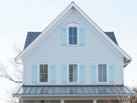 hardi-plank-arctic white home remodel with light blue window shutters