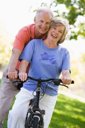 Senior couple on cycle ride in countryside