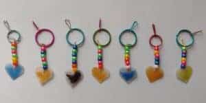 Picture of beaded keychains made by a preschooler with Shrinky Dink heart pendants