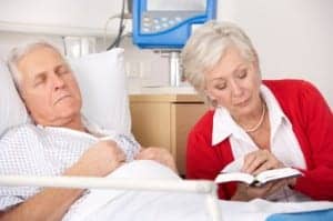 Senior woman visiting husband in hospital