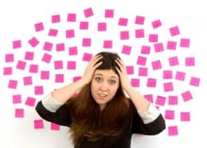 Decision making young woman  with pink sticky notes, question mark