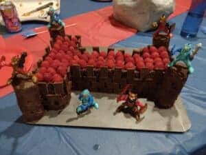 Picture of a chocolate castle cake with knight figures