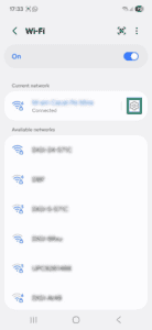 Android Wi-Fi page, showing a highlighted cog icon next to the current network.