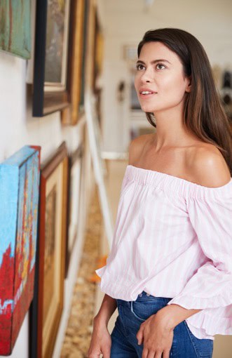 Young woman looking at gallery