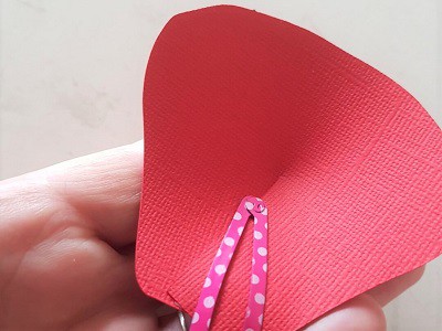 Tip to hold paper flower petal closed while the glue is drying